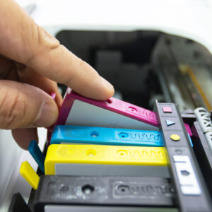 technicians are install setup the ink cartridge of a inkjet prin
