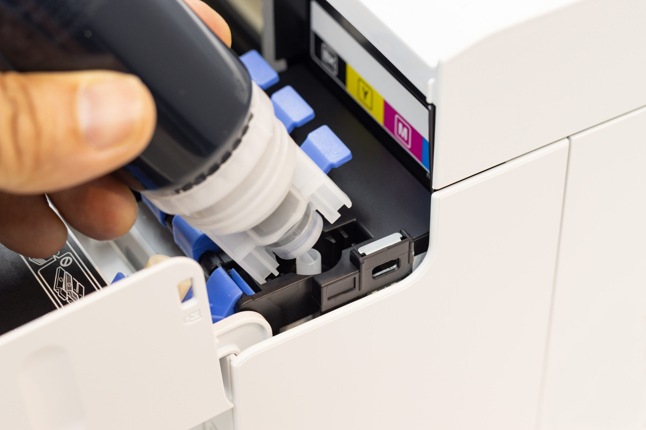 technicians are installing setup the ink and insert ink into the