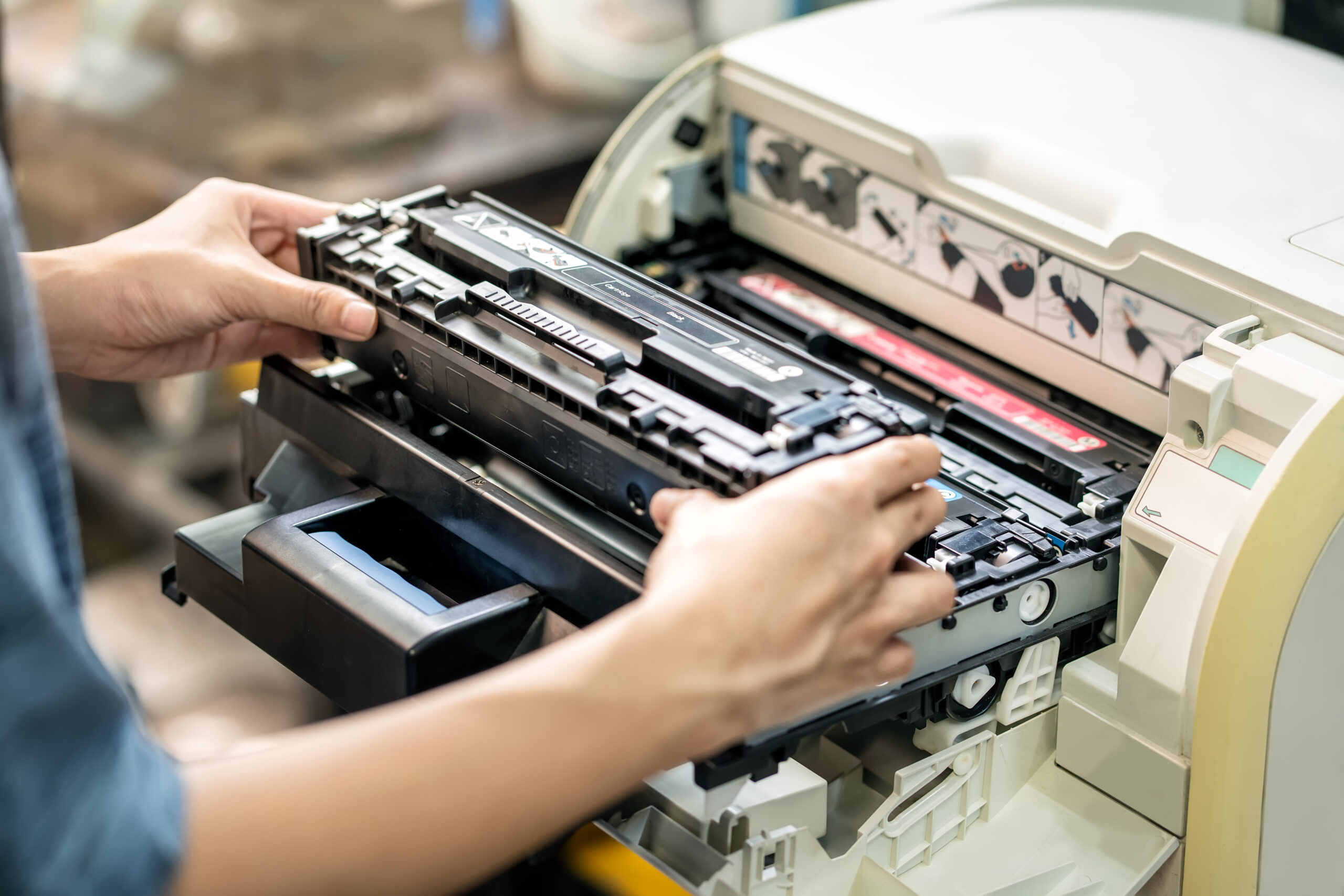 women holding laser toner cartridge ,replacing toner in laser pr